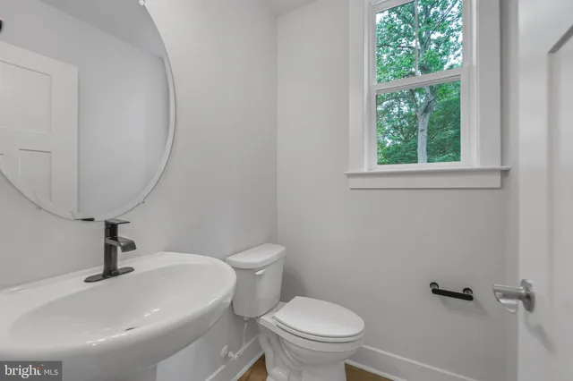 a bathroom with a double vanity sink mirror and a shower