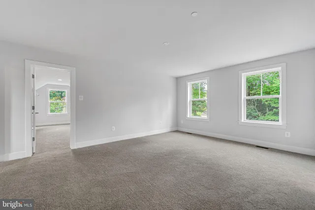 a view of an empty room and window
