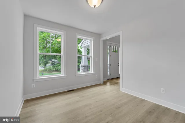 a view of an empty room with windows