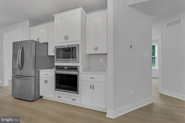 a kitchen with cabinets a window and a sink