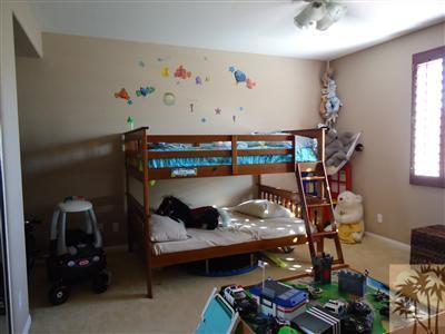 83698 Himalaya Drive Indio, CA 92203 - Photo 11 of 14 a room with furniture and a window