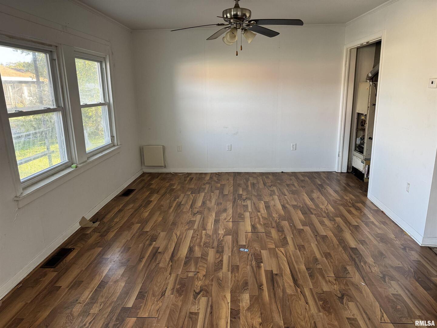 301 East Calvert Street Marion, IL 62959 - Photo 4 of 8 wooden floor in an empty room with a window