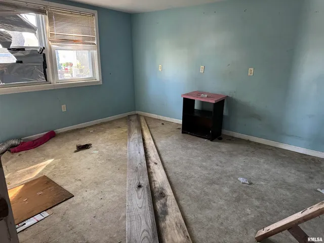 a kitchen with a stove and a window