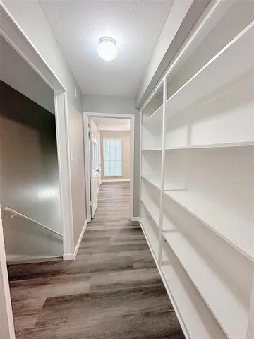 a view of an entryway with wooden floor