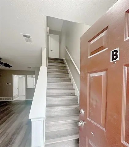 a view of staircase with white walls