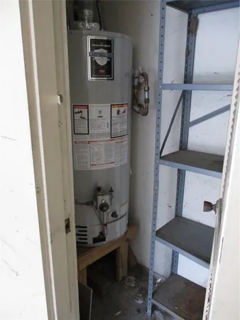 a kitchen with a refrigerator and a sink