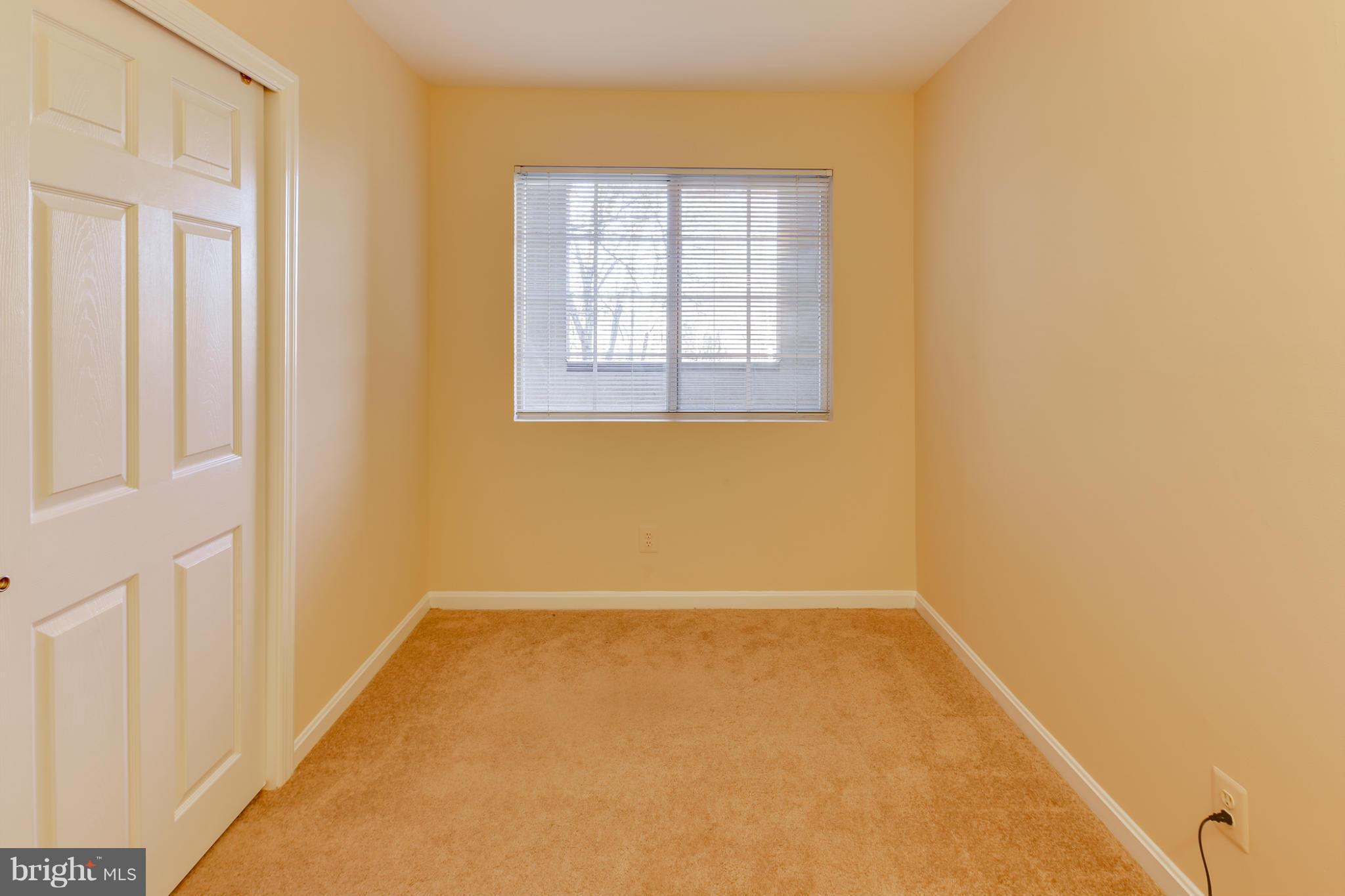 4912 Columbia Road, Unit 6111 Columbia, MD 21044 - Photo 14 of 29 an empty room with windows