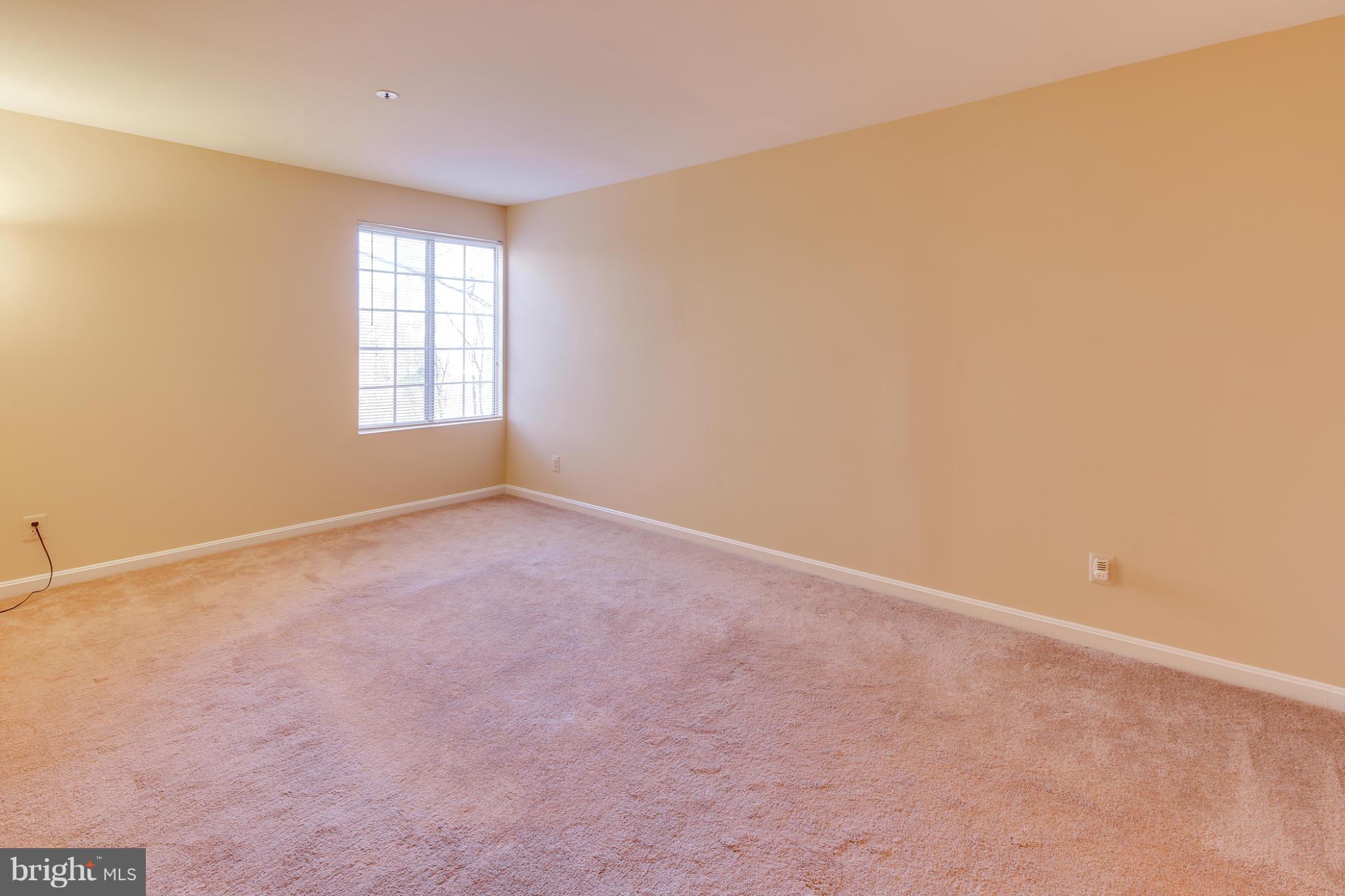 4912 Columbia Road, Unit 6111 Columbia, MD 21044 - Photo 17 of 29 an empty room with windows