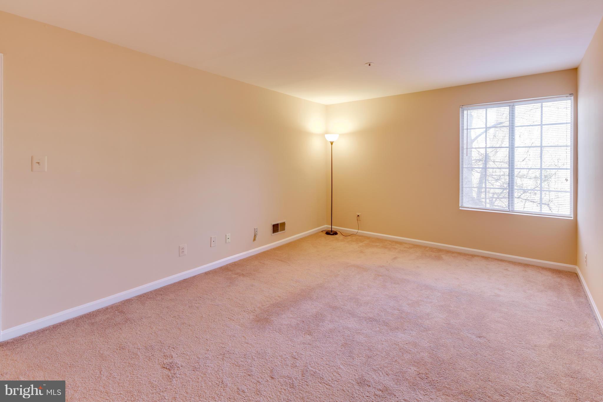 4912 Columbia Road, Unit 6111 Columbia, MD 21044 - Photo 18 of 29 an empty room with windows