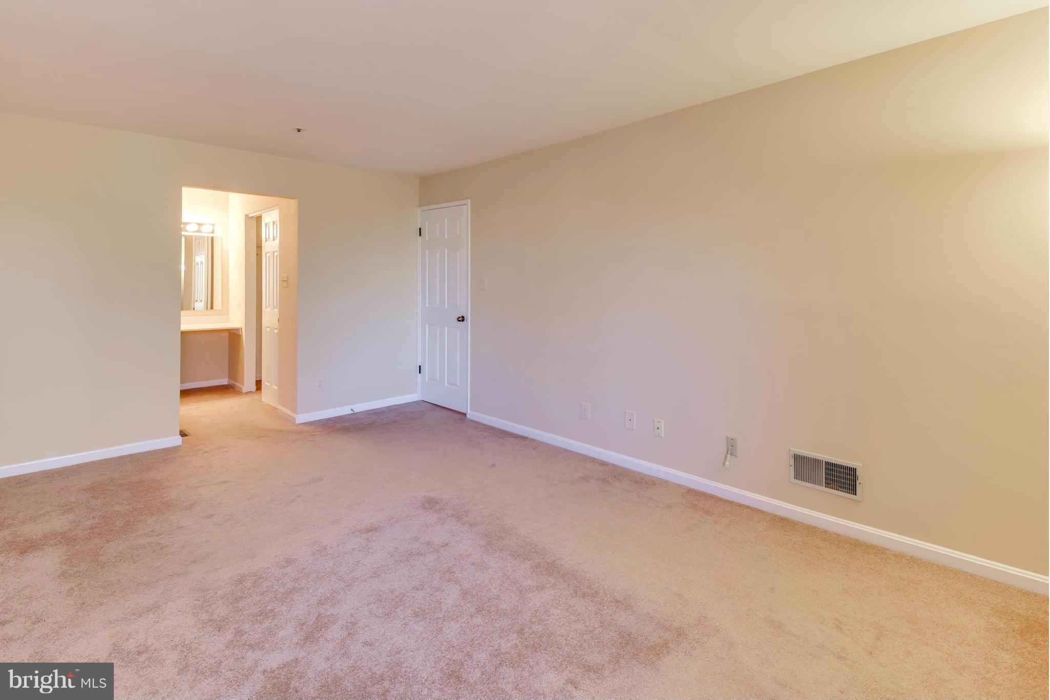 4912 Columbia Road, Unit 6111 Columbia, MD 21044 - Photo 19 of 29 an empty room with windows
