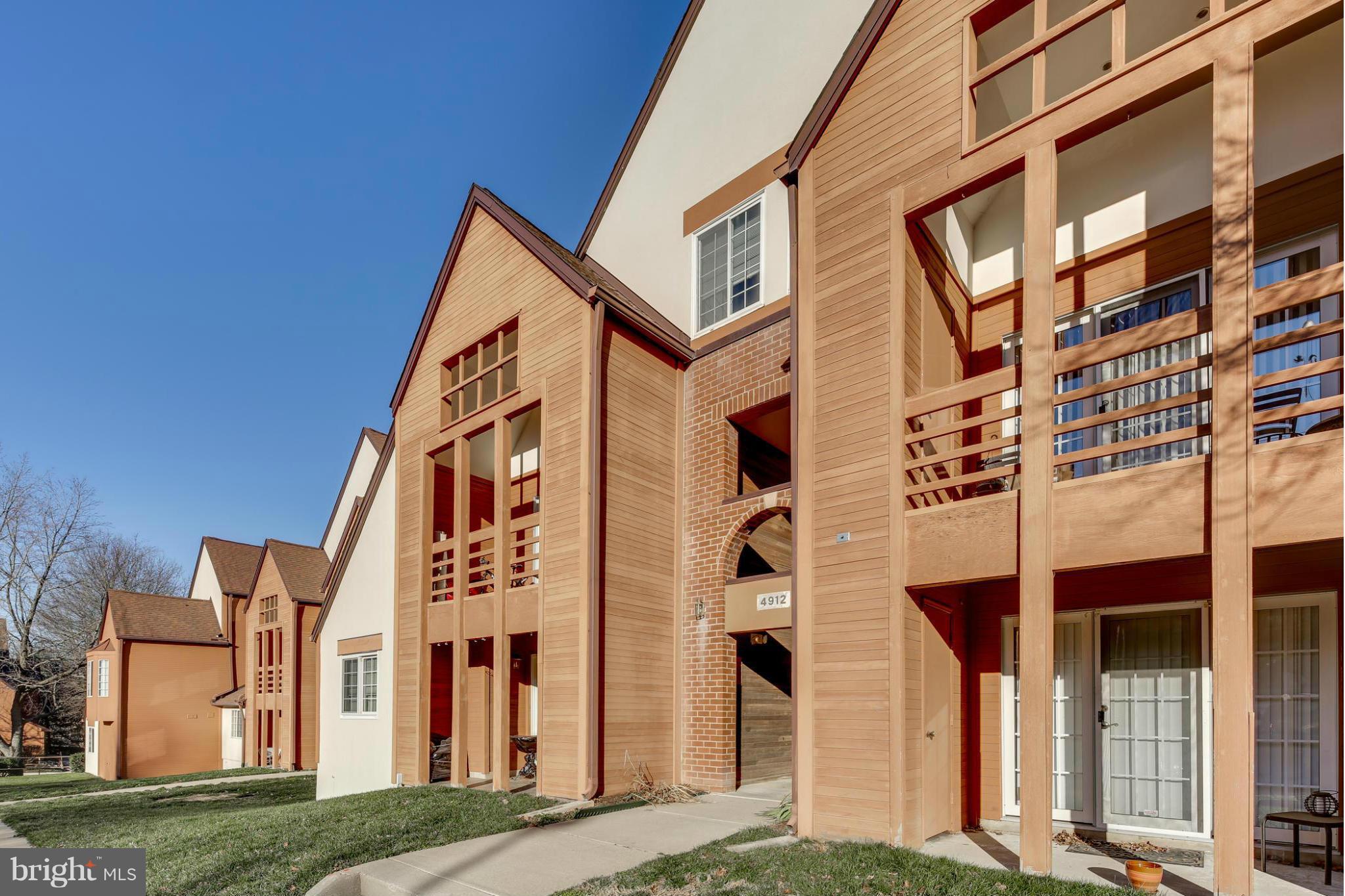 4912 Columbia Road, Unit 6111 Columbia, MD 21044 - Photo 28 of 29 a view of a building with a street