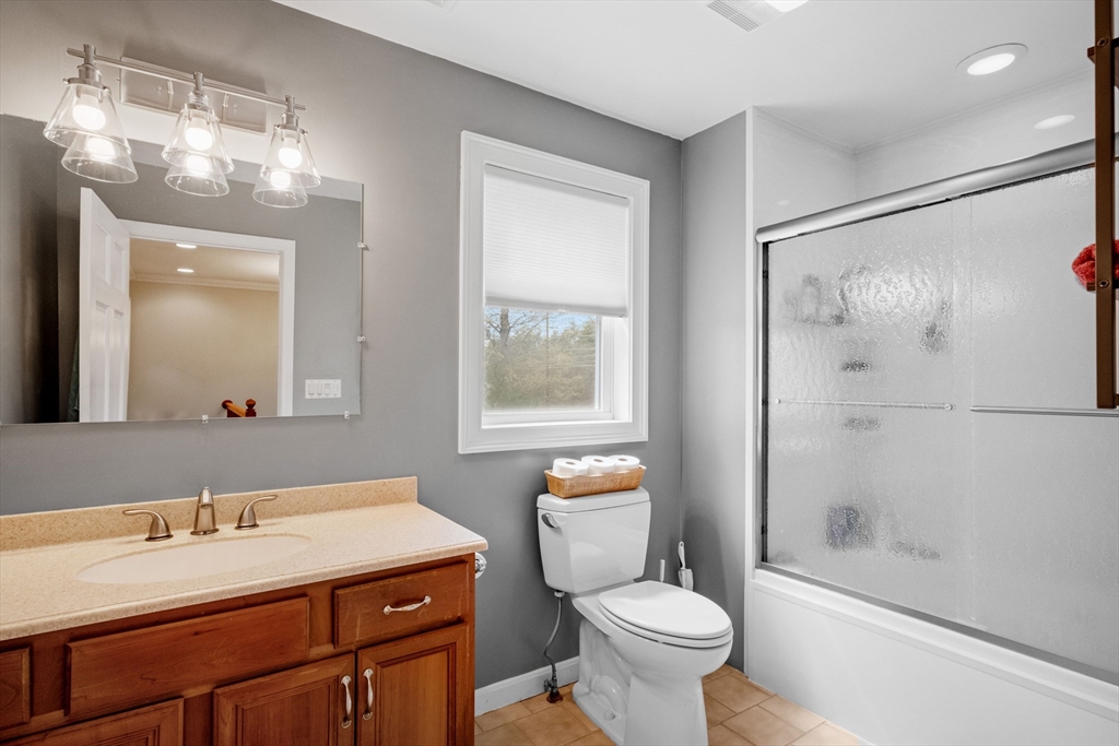 275 Lucas Road Manchester, NH 03109 - Photo 26 of 39 a bathroom with a granite countertop sink toilet and shower