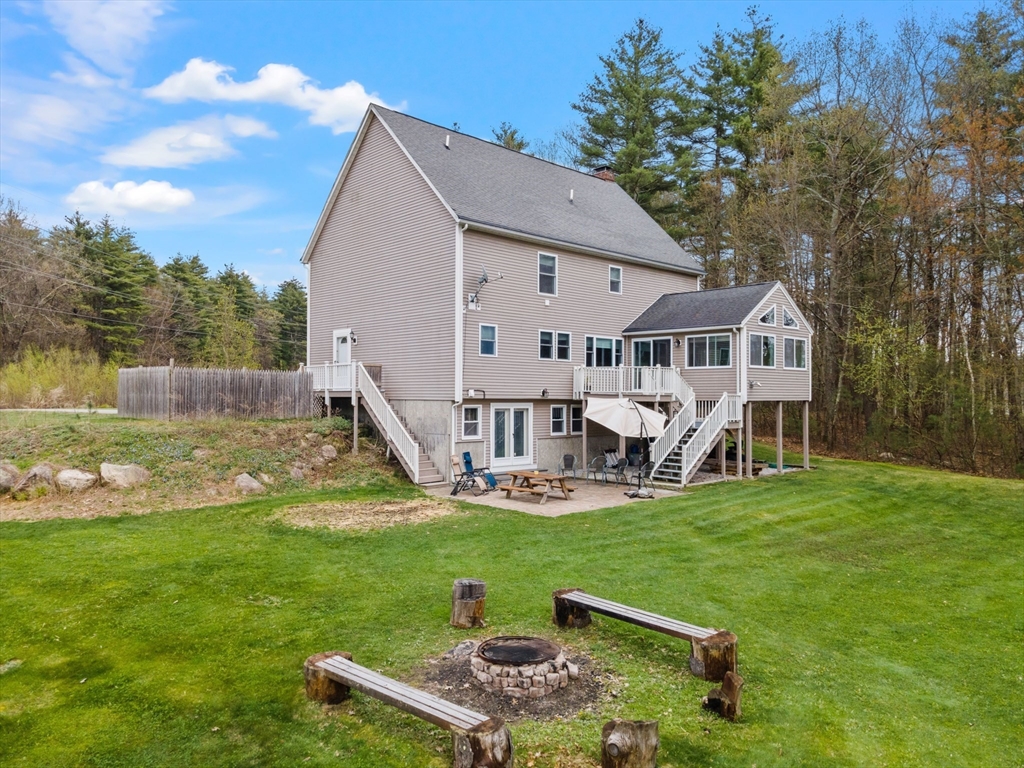 275 Lucas Road Manchester, NH 03109 - Photo 35 of 39 a view of a house with a yard deck and sitting area