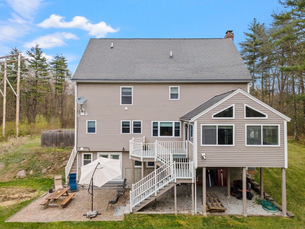 275 Lucas Road Manchester, NH 03109 - Photo 37 of 39 a aerial view of a house with a yard balcony and furniture