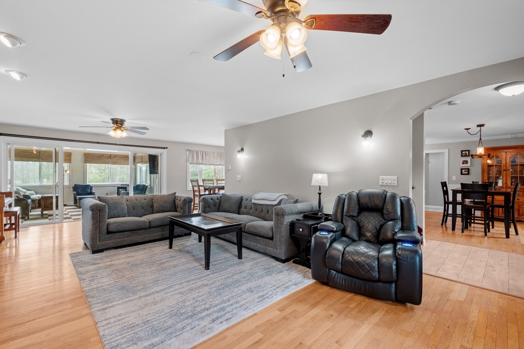 275 Lucas Road Manchester, NH 03109 - Photo 5 of 39 a living room with furniture and a wooden floor