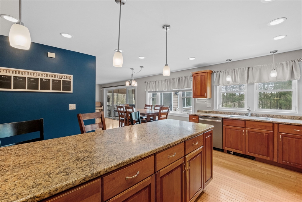 275 Lucas Road Manchester, NH 03109 - Photo 10 of 39 a kitchen with granite countertop a sink a counter top space and stainless steel appliances