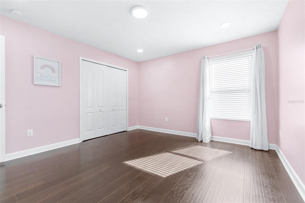 1762 Hadden Hall Place Trinity, FL 34655 - Photo 31 of 49 an empty room with wooden floor and windows