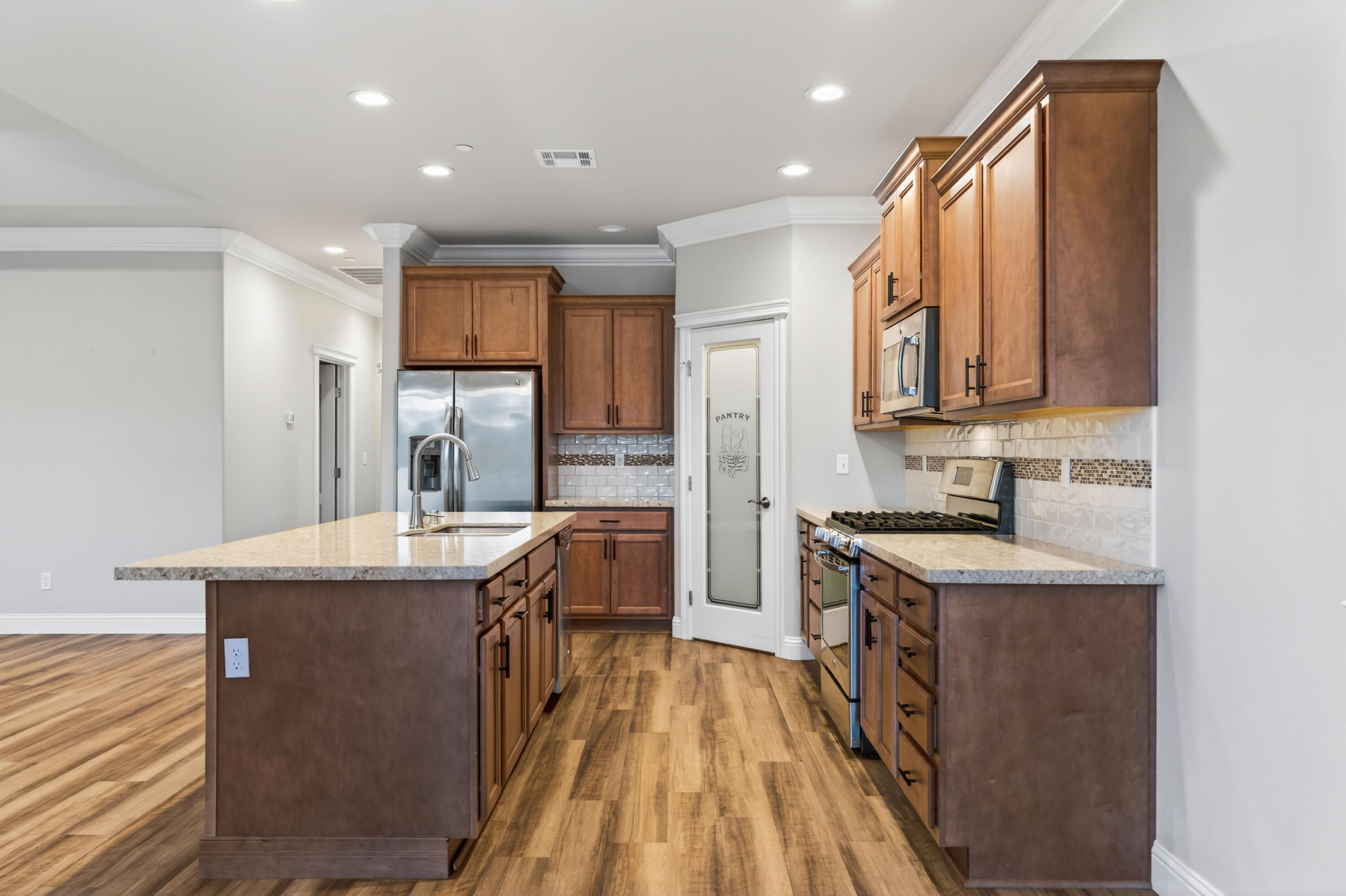 4585 Risstay Way Shasta Lake, CA 96019 - Photo 13 of 36 a kitchen with stainless steel appliances granite countertop a sink stove and refrigerator