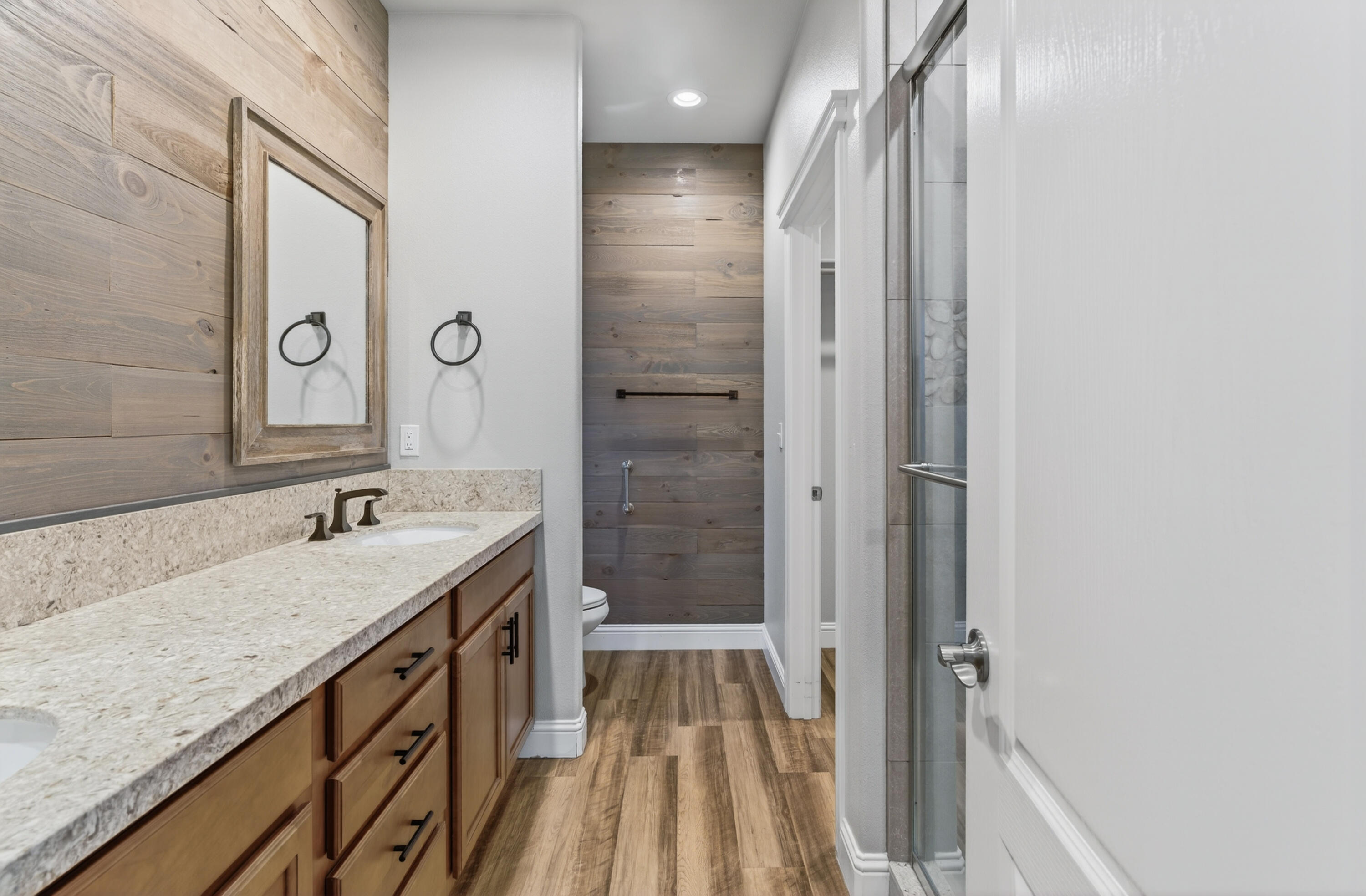 4585 Risstay Way Shasta Lake, CA 96019 - Photo 24 of 36 a bathroom with a granite countertop sink and a mirror