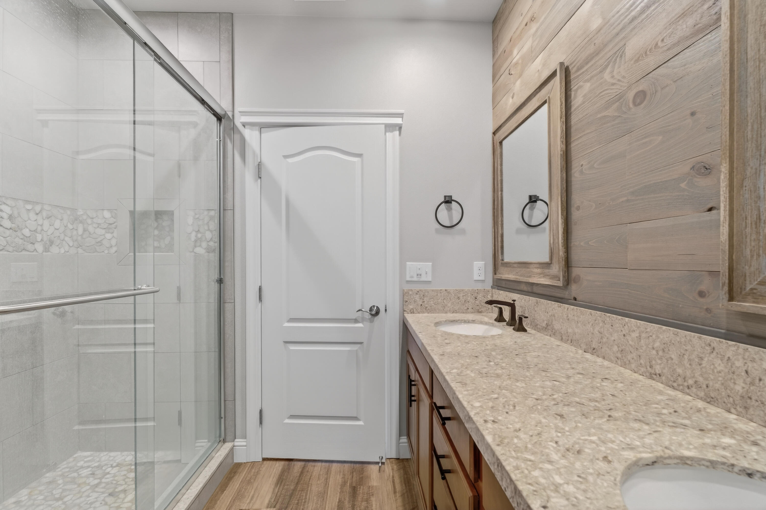 4585 Risstay Way Shasta Lake, CA 96019 - Photo 26 of 36 a bathroom with a granite countertop sink a mirror and shower