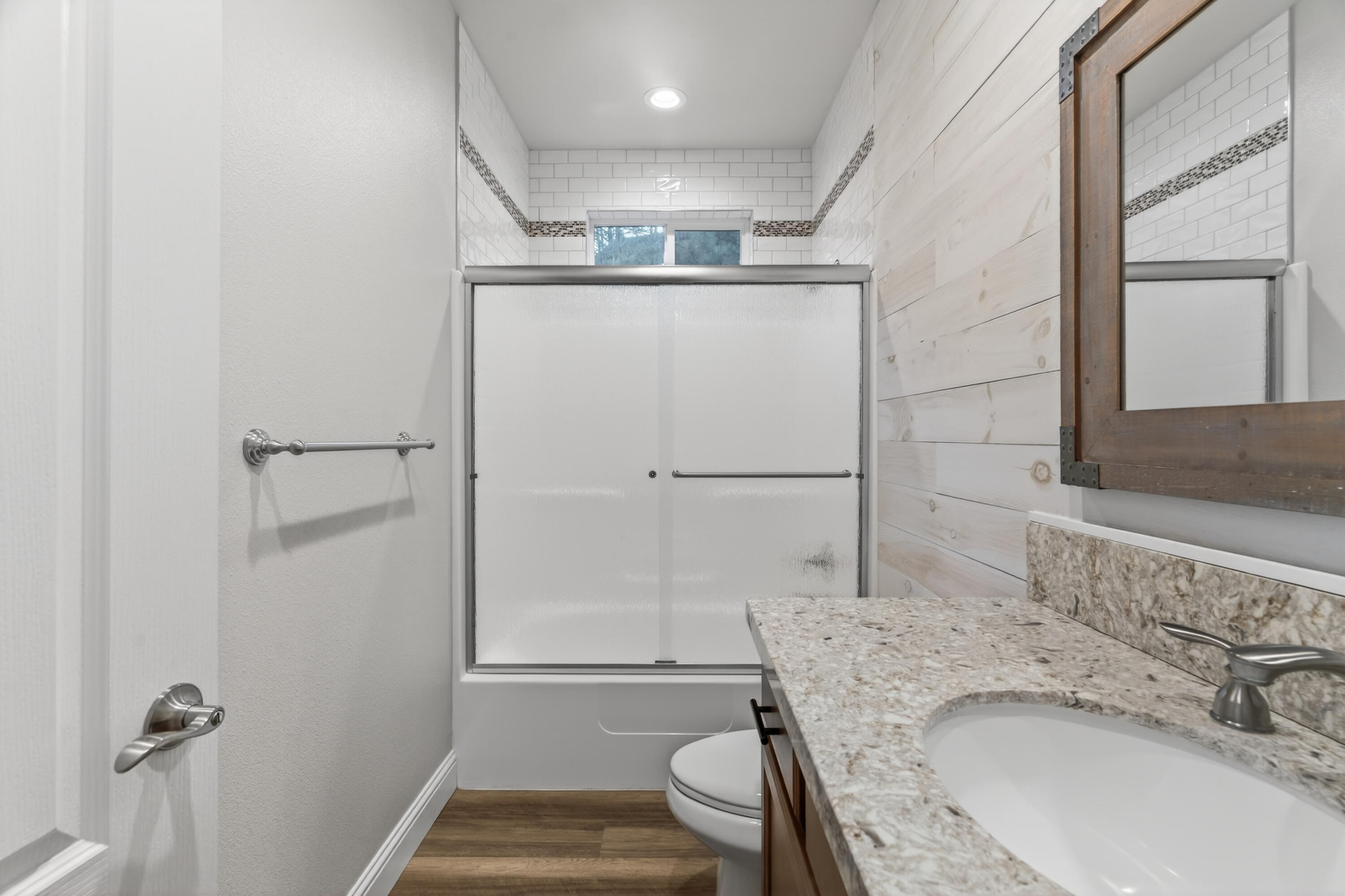 4585 Risstay Way Shasta Lake, CA 96019 - Photo 29 of 36 a bathroom with a granite countertop sink a toilet and shower