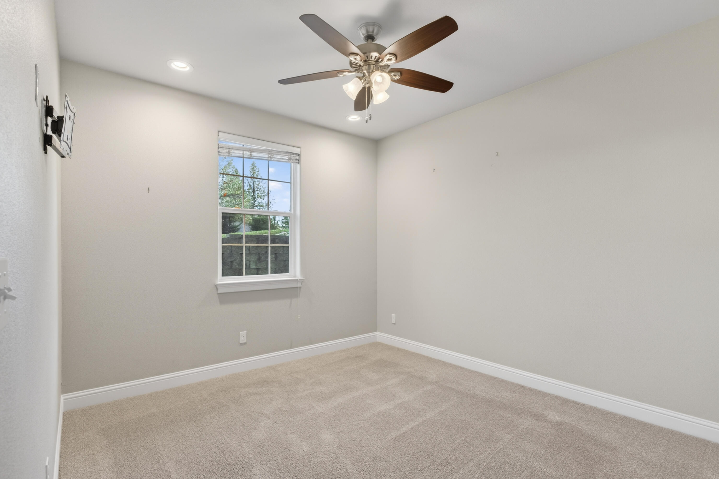 4585 Risstay Way Shasta Lake, CA 96019 - Photo 31 of 36 an empty room with windows and fan