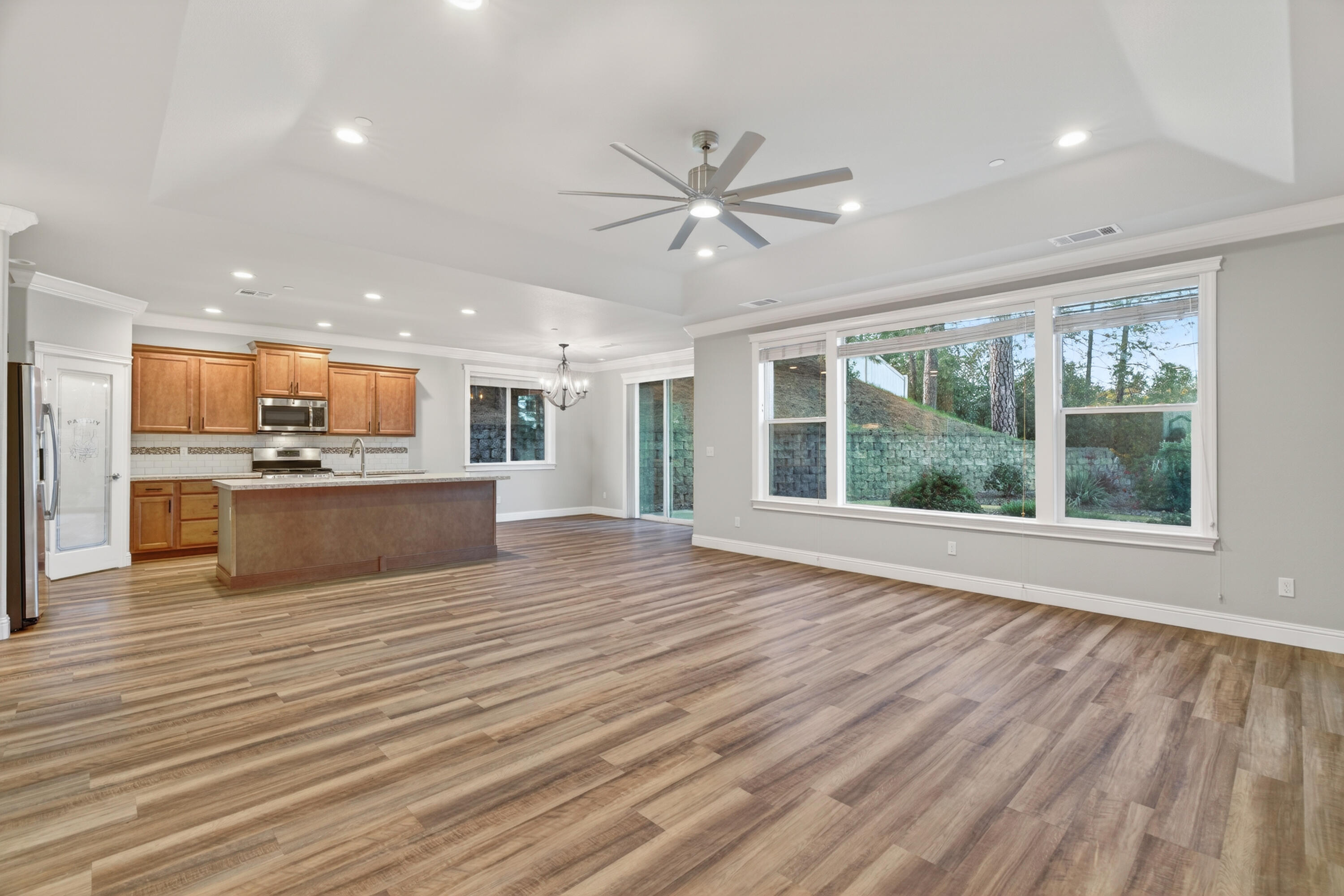 4585 Risstay Way Shasta Lake, CA 96019 - Photo 8 of 36 a view of kitchen with wooden floor and window