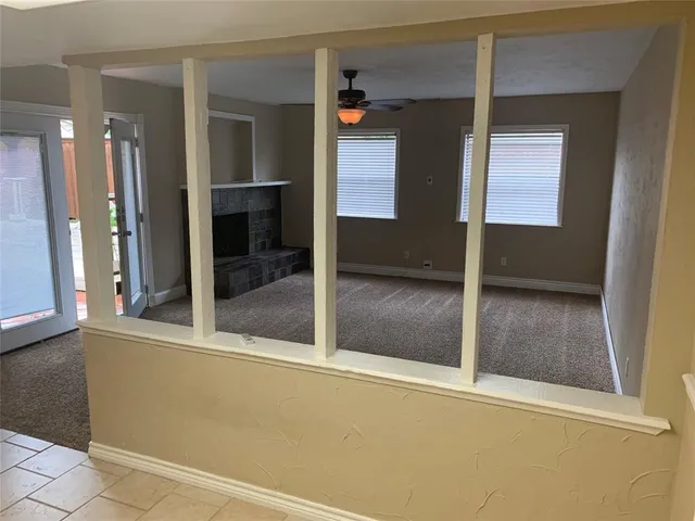 a kitchen with stainless steel appliances granite countertop a sink a stove and a microwave