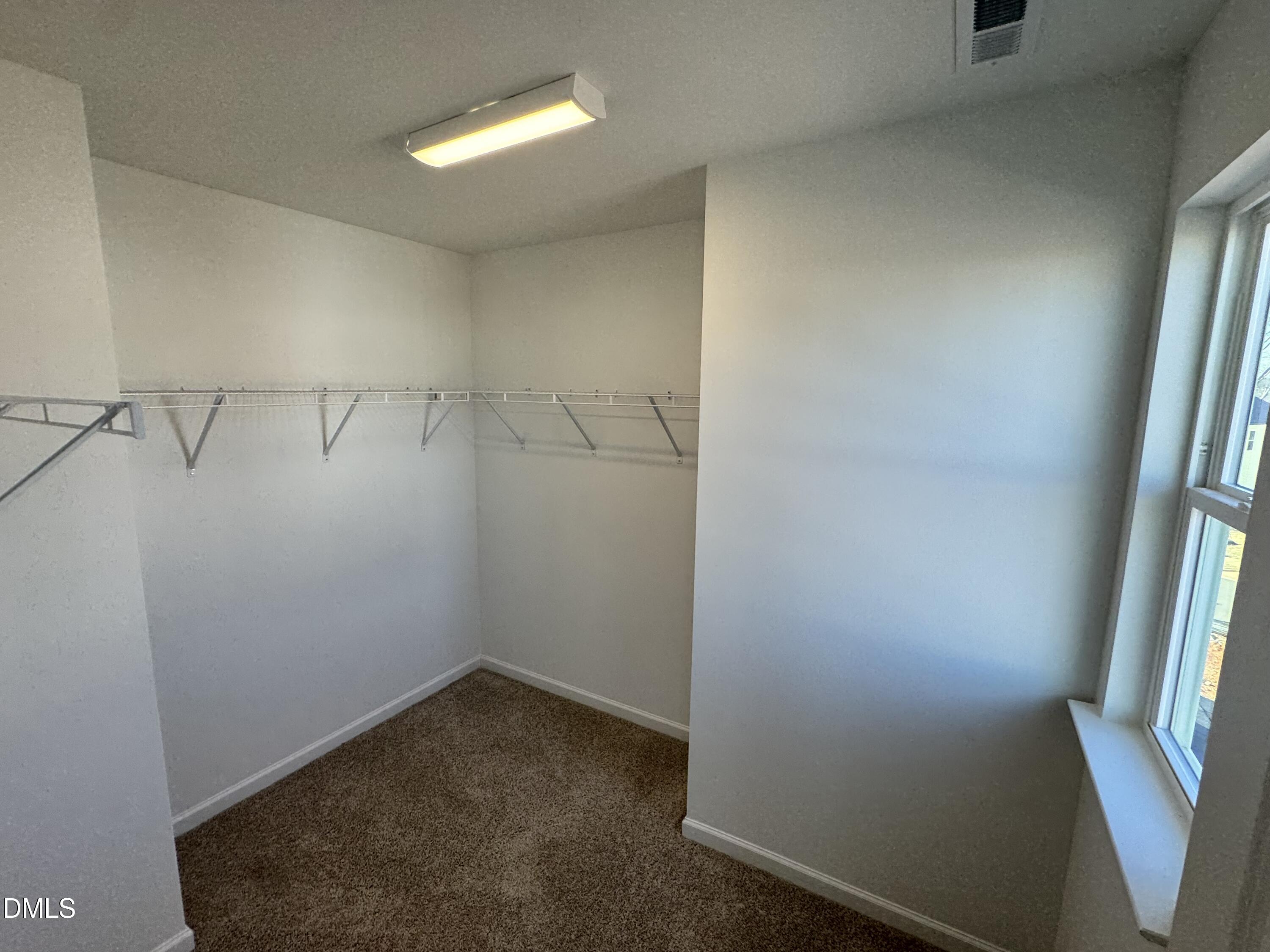151 Sprenger Street Garner, NC 27529 - Photo 11 of 22 an empty room with windows