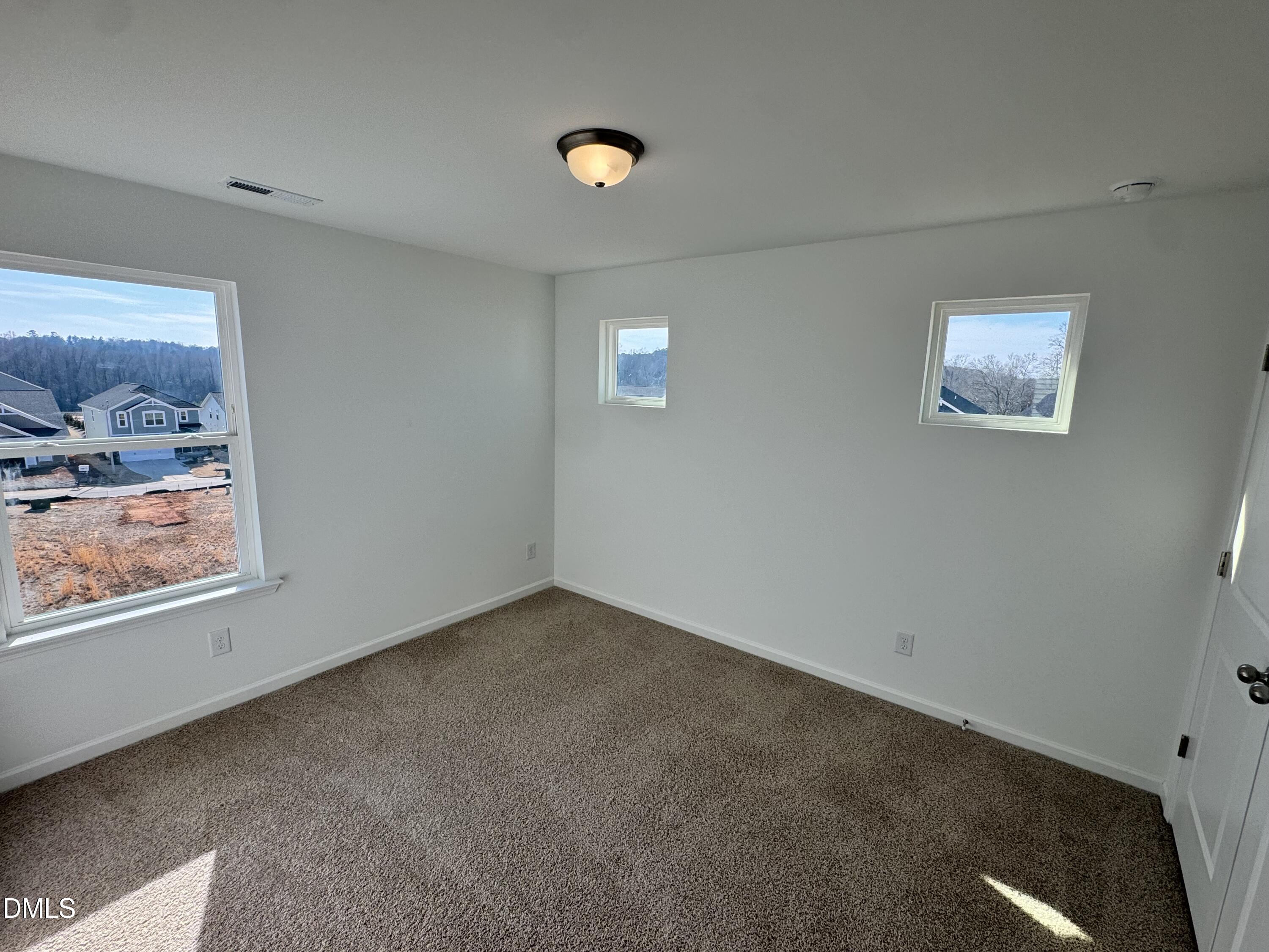 151 Sprenger Street Garner, NC 27529 - Photo 12 of 22 en empty room with window