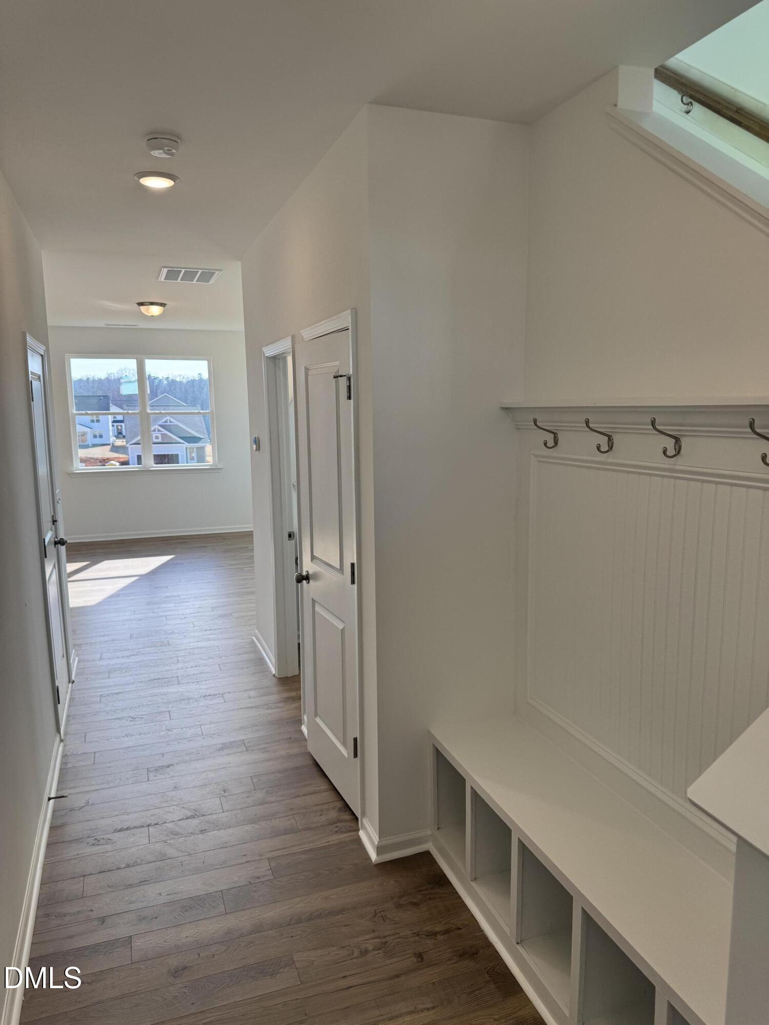 151 Sprenger Street Garner, NC 27529 - Photo 5 of 22 a view of a hallway with wooden floor