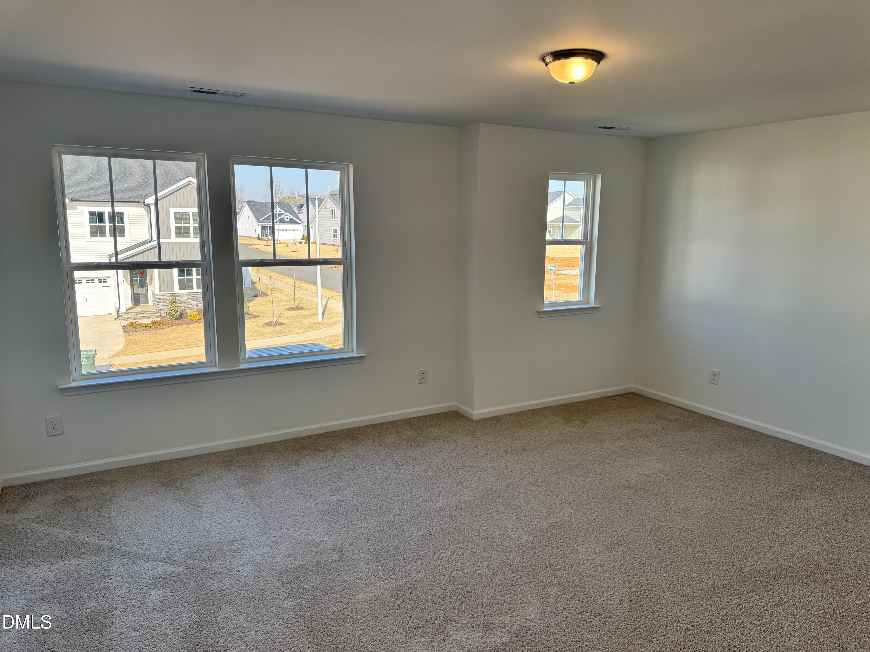151 Sprenger Street Garner, NC 27529 - Photo 8 of 22 an empty room with a window
