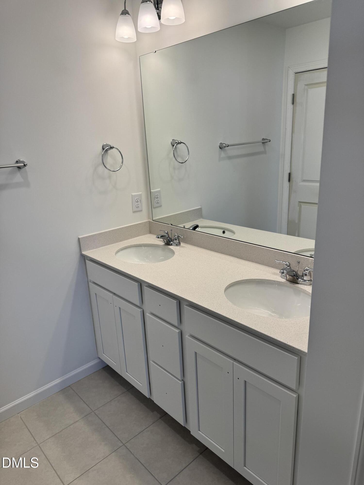 151 Sprenger Street Garner, NC 27529 - Photo 9 of 22 a bathroom with a sink and a mirror