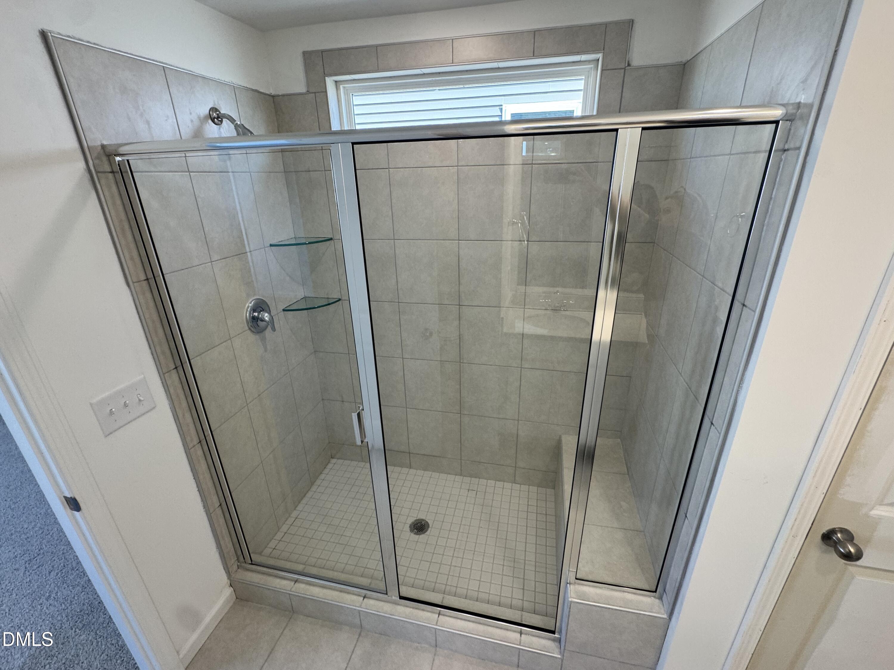 151 Sprenger Street Garner, NC 27529 - Photo 10 of 22 a bathroom with a shower