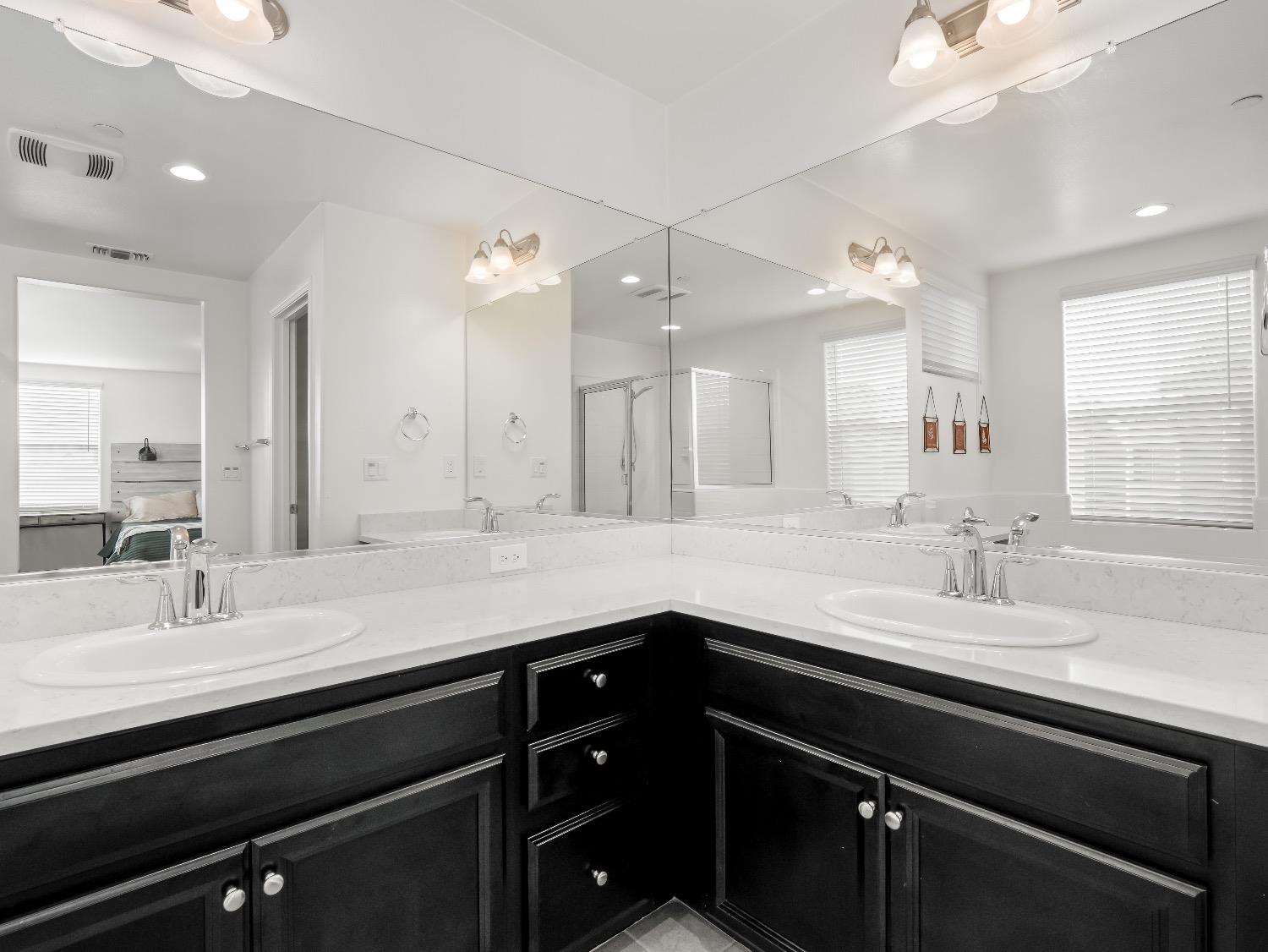 867 Fir Street Madera, CA 93636 - Photo 21 of 39 a bathroom with a sink double vanity and a mirror