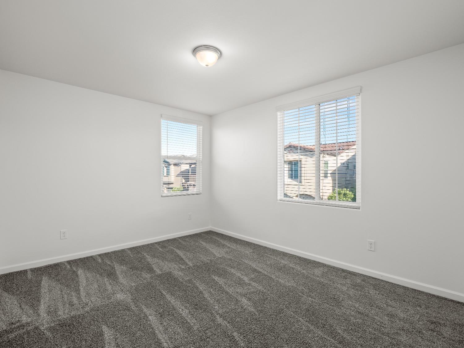 867 Fir Street Madera, CA 93636 - Photo 28 of 39 an empty room with windows