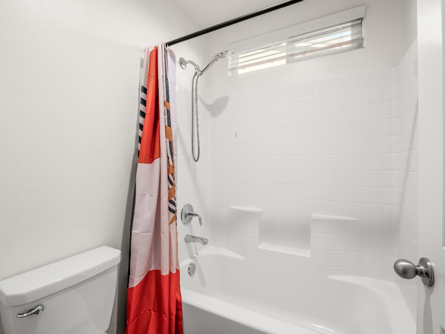867 Fir Street Madera, CA 93636 - Photo 30 of 39 a bathroom with a shower and a toilet
