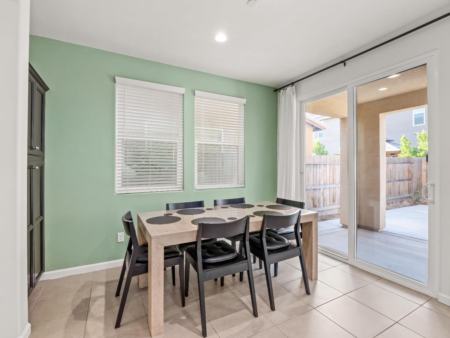 867 Fir Street Madera, CA 93636 - Photo 5 of 39 a view of a dining room with furniture and window
