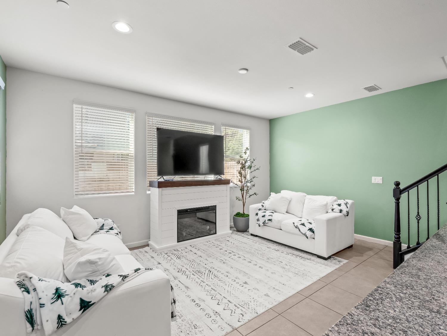 867 Fir Street Madera, CA 93636 - Photo 9 of 39 a bedroom with a bed and a flat screen tv