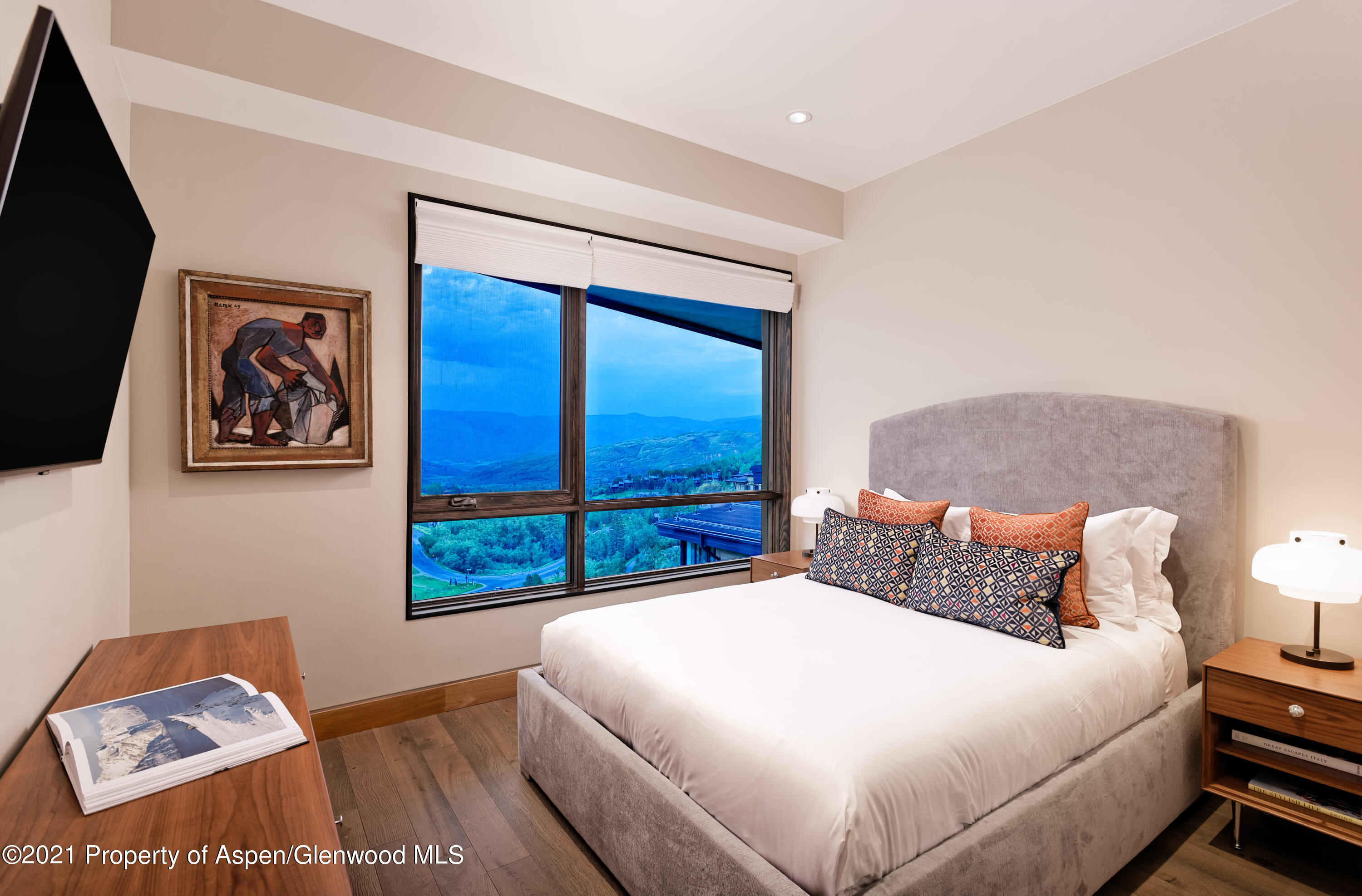 77 Wood Road, Unit 801E Snowmass Village, CO 81615 - Photo 12 of 30 a bedroom with a bed and wall painting