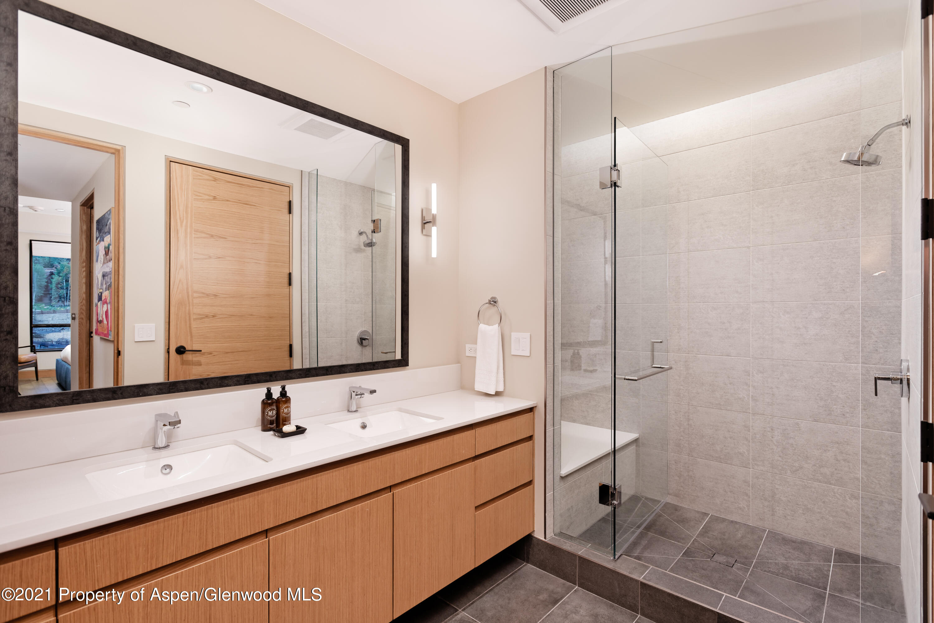 77 Wood Road, Unit 801E Snowmass Village, CO 81615 - Photo 14 of 30 a bathroom with a double vanity sink mirror and double