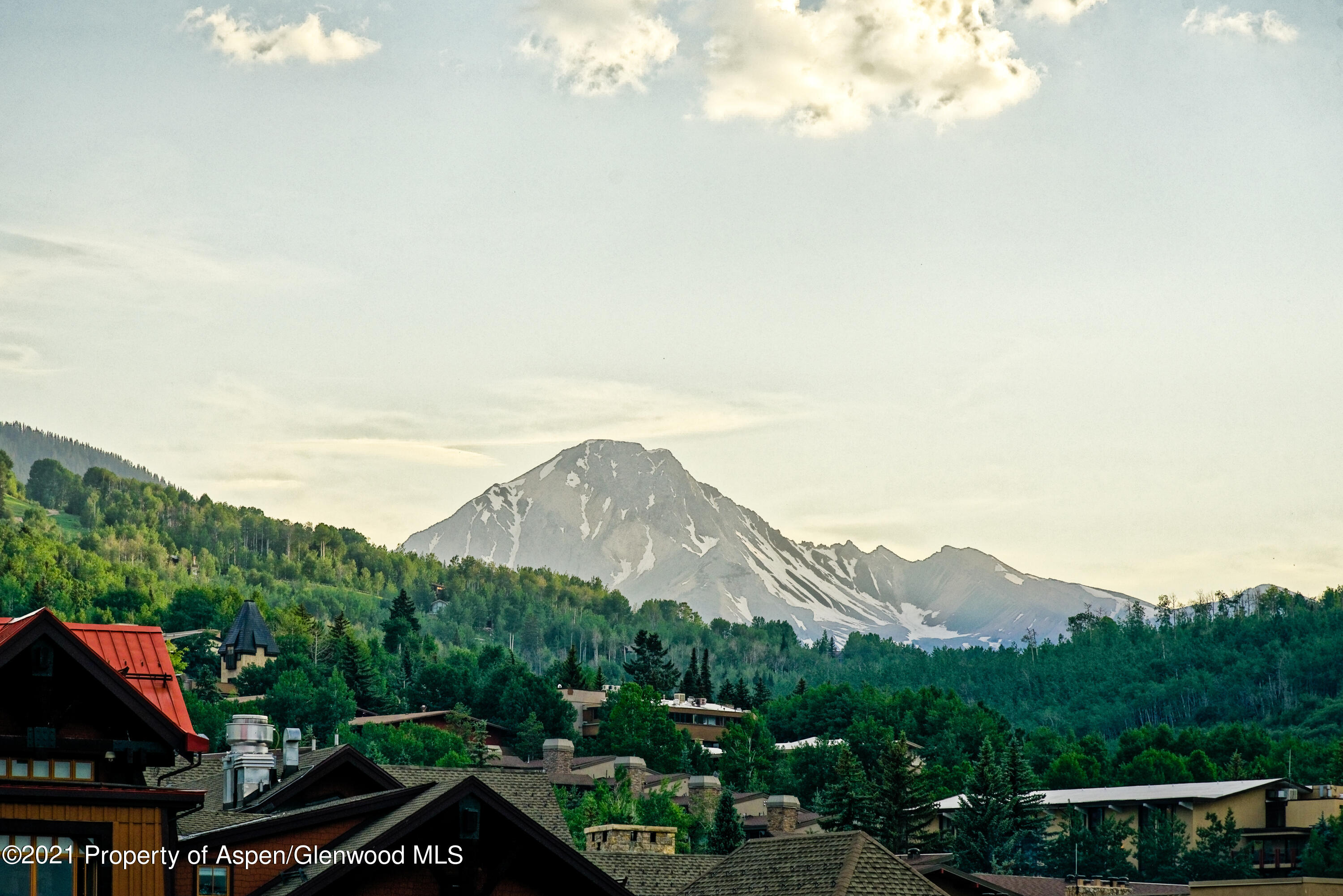 77 Wood Road, Unit 801E Snowmass Village, CO 81615 - Photo 27 of 30 a view of a town with mountains in the background