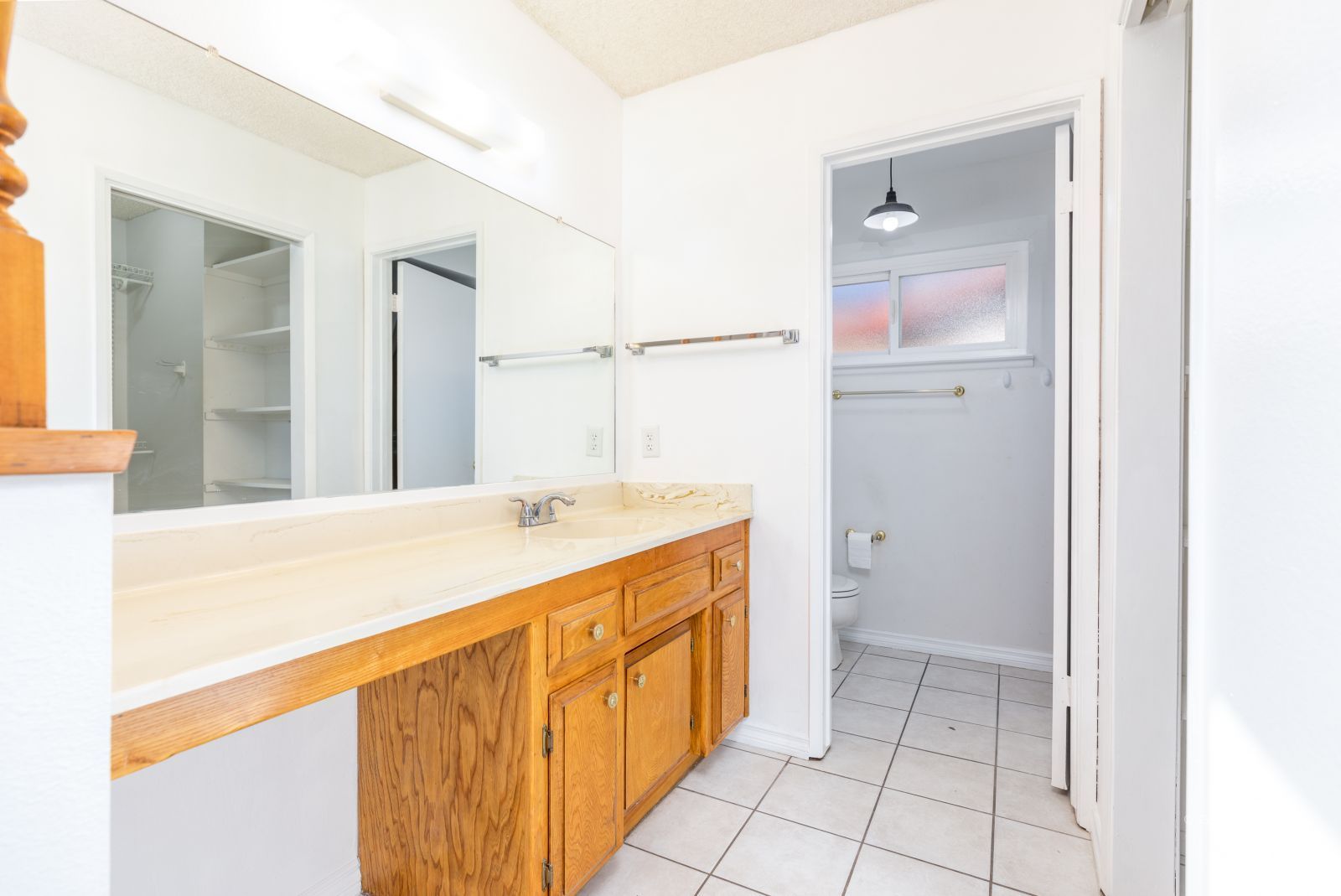 1225 North Erwin Street Ridgecrest, CA 93555 - Photo 16 of 27 a spacious bathroom with a tub sink and mirror