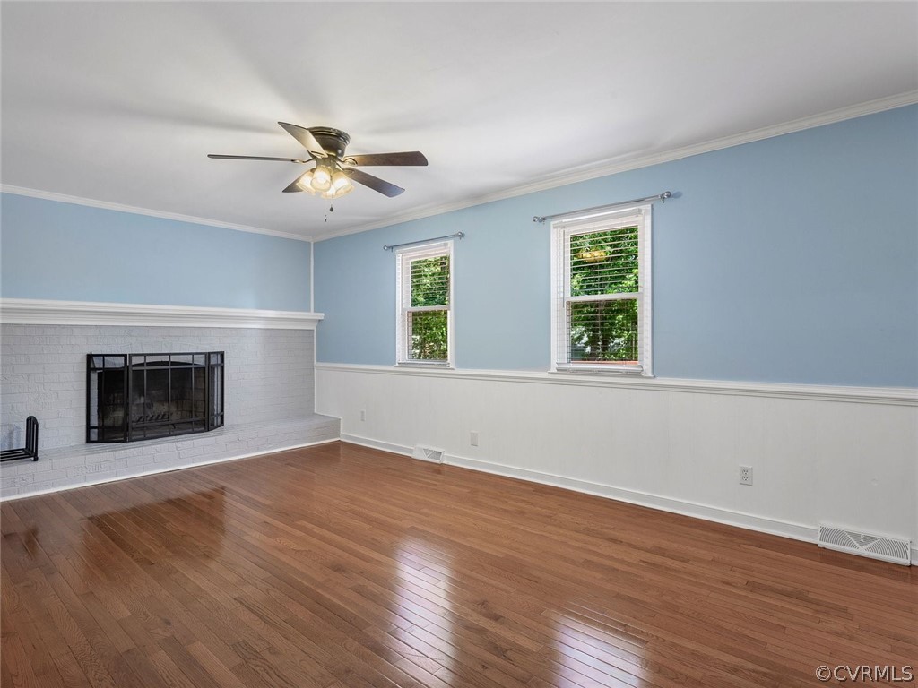 441 Walton Park Road Midlothian, VA 23114 - Photo 6 of 31 an empty room with windows and fireplace