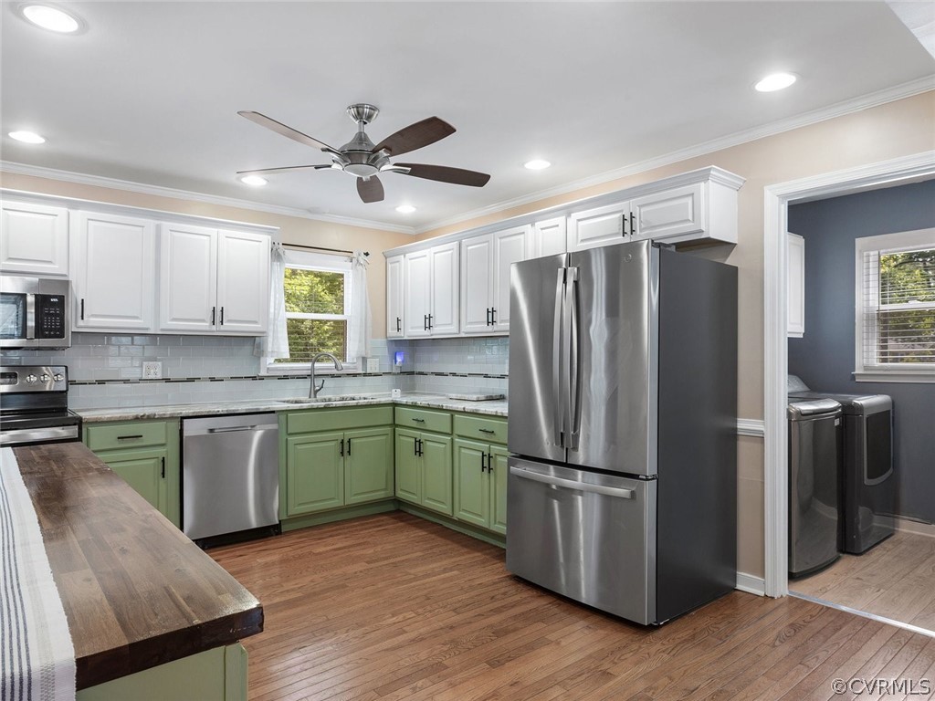 441 Walton Park Road Midlothian, VA 23114 - Photo 9 of 31 a kitchen with granite countertop stainless steel appliances a refrigerator cabinets and wooden floor