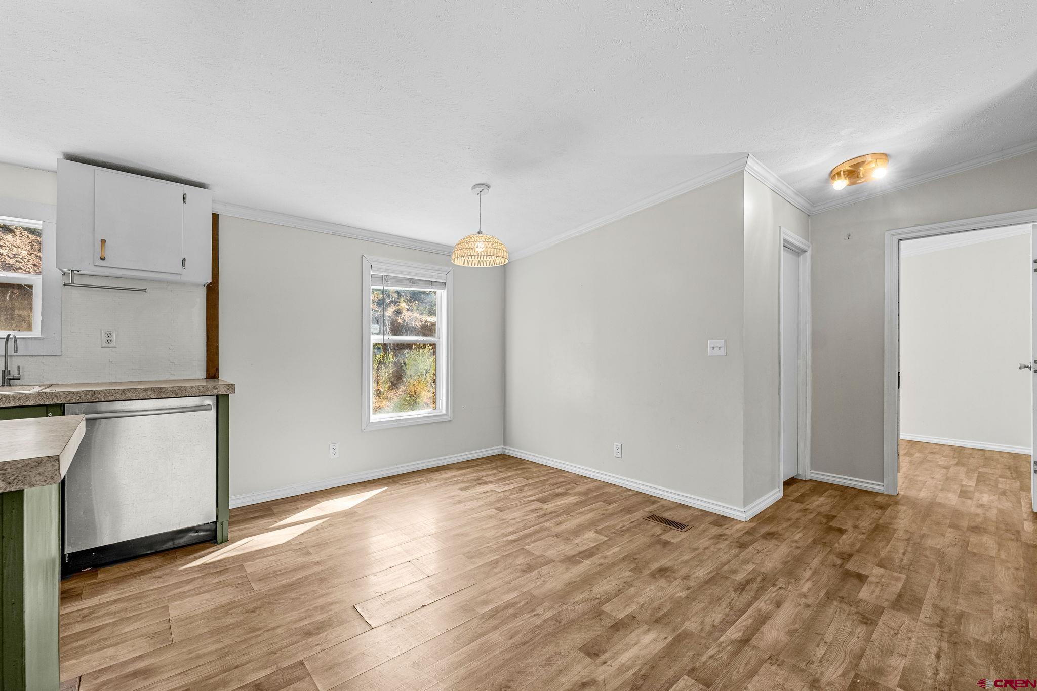 1969 County Road 142 Durango, CO 81303 - Photo 20 of 30 a view of an empty room with window and wooden floor