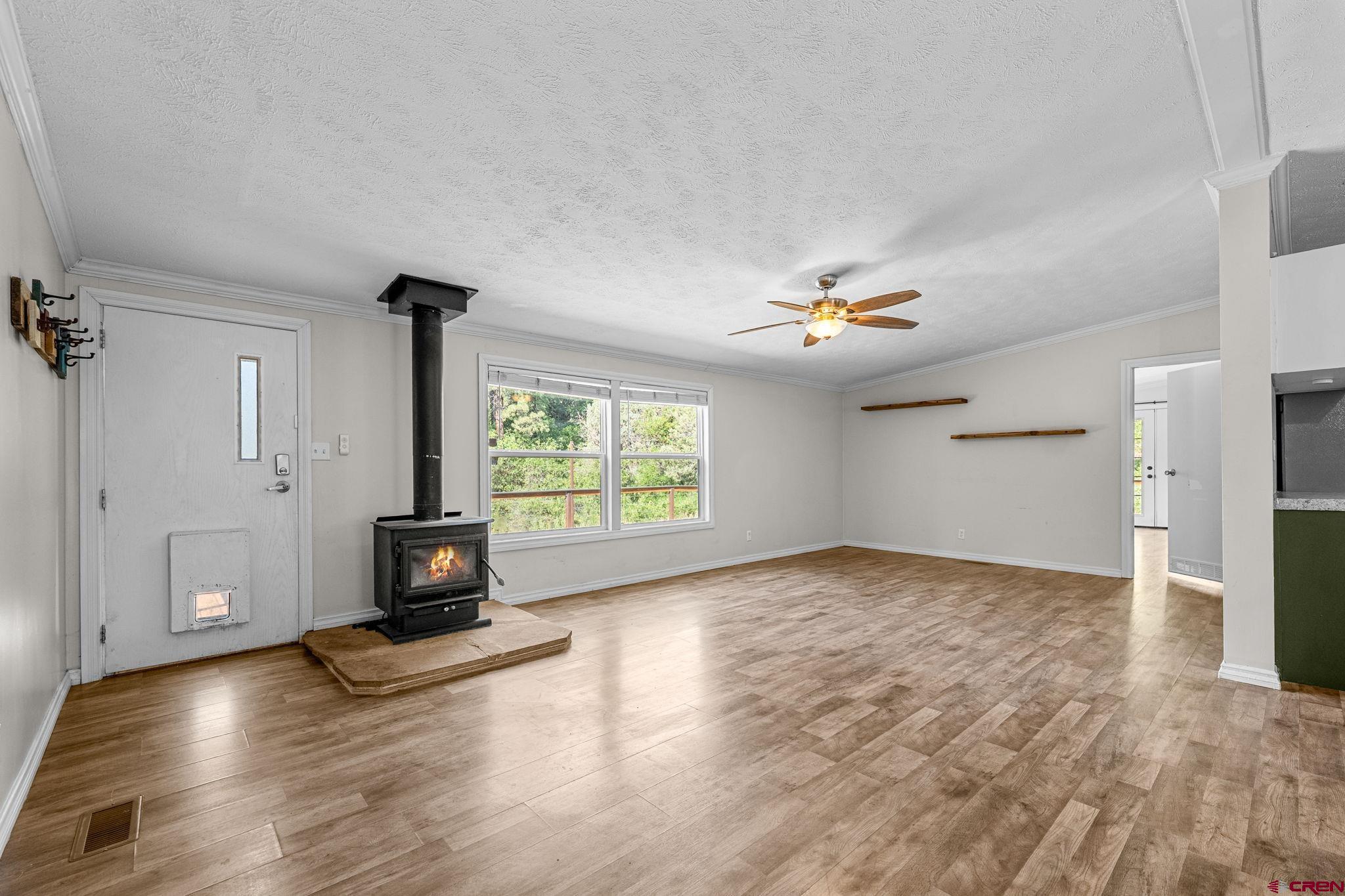 1969 County Road 142 Durango, CO 81303 - Photo 7 of 30 a view of empty room with wooden floor and fan