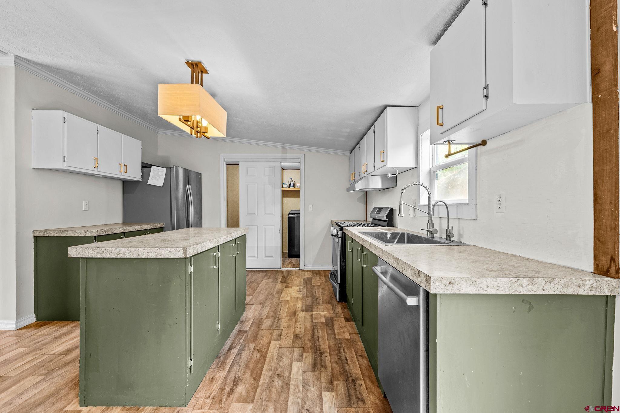 1969 County Road 142 Durango, CO 81303 - Photo 10 of 30 a kitchen with a sink appliances and cabinets