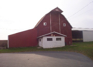 7427 East Maize Road Ridott, IL 61067 - Photo 2 of 5 a front view of a house with a yard