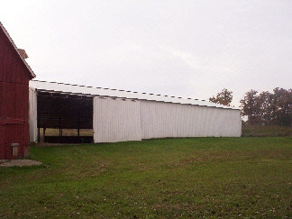 7427 East Maize Road Ridott, IL 61067 - Photo 3 of 5 a view of a terrace with a garden